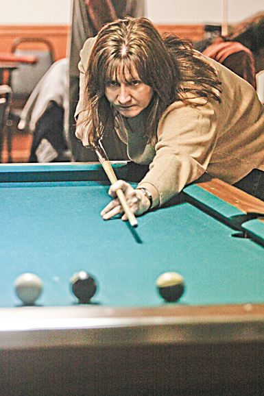  Michelle Beard of Boardman competes in the American Poolplayers Association Second Chance Tournament at Avon Oaks Ballroom in Girard on the team Dark Knights.
