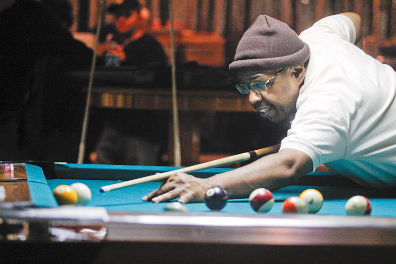 HIS SHOT: Richie Ross of Youngstown competes in the American Poolplayers Association Second Chance Tournament at Avon Oaks Ballroom in Girard.
