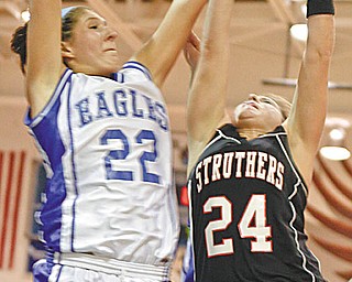Struthers' Ashley Baron (24) and Hubbard's Haley Turner (22) during the first period Monday.