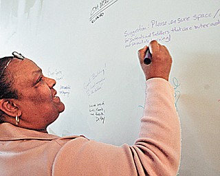  Orenda Johnson of the Hine Foundation leaves her mark (and idea) on the drywall at the new OH WOW.