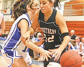 NICE PLAY: Hubbard’s Krista Julian (10) knocks the ball away from Struthers’ Dana Mathews during the first period Monday.