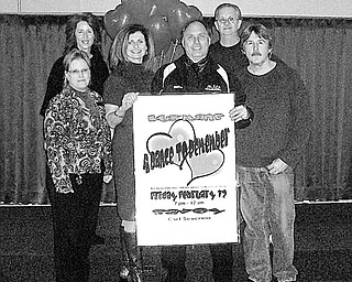 Special to The Vindicator
SIGN OF THE TIMES: Among those displaying a sign announcing a benefit “Dance to Remember” to take place from 7 p.m. to midnight on Feb. 12 at Kuzman’s in Girard are, from left, Brenda Williams, Debbie Lavelle, Susan Ryan, Stephen Barba, Larry Maffitt and Jim Dunn, committee members. Other committee members, not pictured, are Karen Stoner, Karen Elder, Debbie Welch, George Welch, Allyson Clark, Meg Daniluka, Michele Dunn and Carl Severino. 