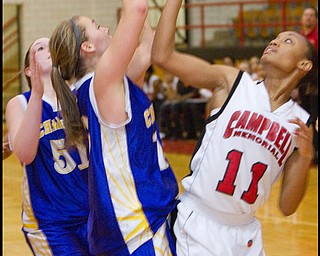 The Vindicator/Geoffrey Hauschild.Champion's Lindsay Swipas (10) Campbell's Brande Ellington (11) during the fourth quarter of a game at Campbell High School on Wednesday evening.