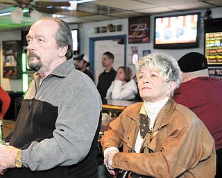 VALLEY VIEWERS: Jack Koscelansky and Dee Troll of Austintown watch the State of the Union address at Ball Busters Sports Bar in Austintown. 
