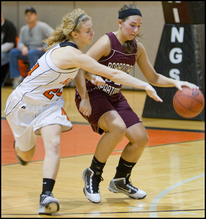 The Vindicator/Geoffrey Hauschild.Boardman's Monica Touvelle (32) shields the ball from Hoover's Lindsey Fiala (24) during the third quarter of a game at Hoover High School on Saturday afternoon.