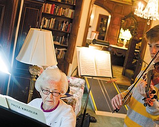The Vindicator/Geoffrey Hauschild.Kathryn Walker plays piano as Pat Strasik, a junior at Boardman High School, prepares for an upcoming solo and ensemble during a music lesson at Glenellen Retirement Center on Friday afternoon. Strasik has been receiving lessons from Walker since seventh grade.