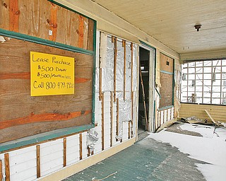 The Vindicator/Robert K. Yosay -----.. A row of houses..all slated for demolition .. on E Ravenwood... a steal and an open door.-30-