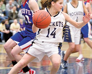 The Vindicator/Geoffrey Hauschild.Lowellville's Emily Carlson (14) cuts back in front of Western Reserve's Colleen Kennehan (10) on her way to the basket during the third quarter of a game at Lowellville High School on Monday evening.