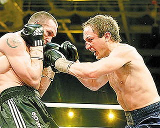 AFTERMATH: Billy Lyell, right, trades punches with Sebastian Sylvester of Germany during their IBF middleweight title fight in Neubrandeburg, Germany, on Saturday. Lyell said he was banged up and bummed out following the defeat, by TKO in the 10th round.