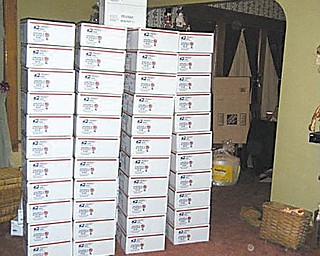 COOKIES SHIPPED: Boxes of cookies sit in Zack Lord’s living room in Hubbard just before being shipped to U.S. military personnel serving overseas.