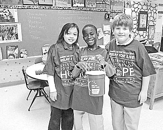 Special to The Vindicator
MAKING A CHANGE: Students at St. Patrick School have been doing their part to support research for a cure for cancer. The children deposited loose change in buckets that had been placed in each classroom. As a result, more than $400 was collected for the American Cancer Society. Displaying one of the buckets are members of Mrs. Yambovich’s fourth-grade class, from left, Samantha Rosser, Guy-Michel Kaho and Daniel Robinson, who shared the spirit of giving.