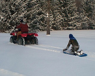 Karl Klockenga is being pulled by his dad, Mark Klockenga. They live in North Benton.