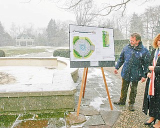 LOOKING FORWARD: Linda Kostka, Mill Creek MetroParks marketing and development director, and Keith Kaiser, parks horticulture director, explain the Seasonal Celebration Plaza plans, which outline the renovation of the Sommer Fountain and surrounding area in Fellows Riverside Gardens. Kaiser said the fountain, built in 1977, was turned off in 2008 because of failing mechanics. The $500,000 construction project is slated to begin in April and should be completed by midsummer.