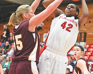 The Vindicator/Lisa-Ann Ishihara---- YSU.Brandi Brown (42) gets blocked by.Loyola Brittany Boeke (55) at Beeghly Center, Thursday February 2, 2010