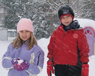Jenna and Jared Benko of Boardman play in the snow.