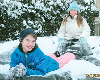 Left, Ashlie Eckman, 10, of Poland, and her best friend, Alaina Fullerman, 9, also of Poland, were playing on the trampoline in the back yard at her grandparentsÕ, Jim and Mary Ann Huesken in Poland..