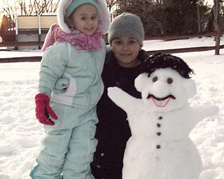 9-year-old Paul and 3-year-old Hannah Proctor of Youngstown built a Mario Snowman..