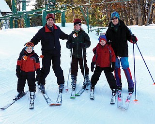 Poland residents Alex, John and Nicholas LaPlante, all of Poland, went skiing at the Medicine Bow Ski resort during a recent trip to Wyoming to visit family for Christmas. Also pictured are a cousin, Venice Sheehan, and aunt, Suzie Spencer..
