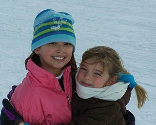 Alyssa and Tara Santoro are enjoying playing on a snow day while off from school at C.H. Campbell in Canfield. They are the daughters of Nick and Amy Santoro..