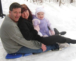 While visiting family in Charlottesville, Va., over the holidays, the Gambles Ñ Mark, Kelli and Emma of Austintown Ñ were surprised to see 22 inches of snow. This was EmmaÕs first time playing in the snow and she absolutely loved it!.