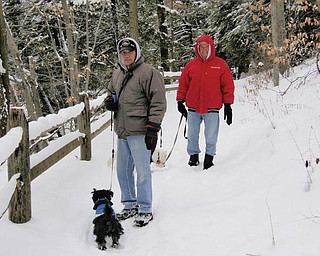Jim Dorney and Frank Matthews of Youngstown were joined by their best friends, Scotty and Barney, for a winter walk in Mill Creek Park..