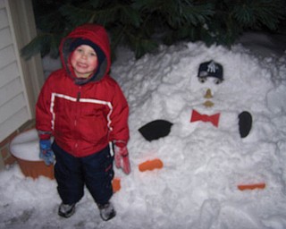 Aidan T. Radinsky of Canfield was playing in the yard with his daddy and his brother, Nolan P. Radinsky, they decided to build a ÒYankee ManÓ instead of a snowman..