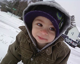 A.J. Holtzman, 16 months, son of Allen and Mindy Holtzman of Charlotte, N.C., formerly of Poland and North Lima, was playing in the snow for the first time. This was a real treat for A.J. because Charlotte rarely gets enough snow to actually play in it..