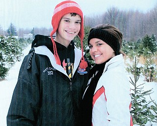 Matt Chuey and his sister, Sarah, both of Poland, stopped long enough for a picture while picking out the family holiday tree..