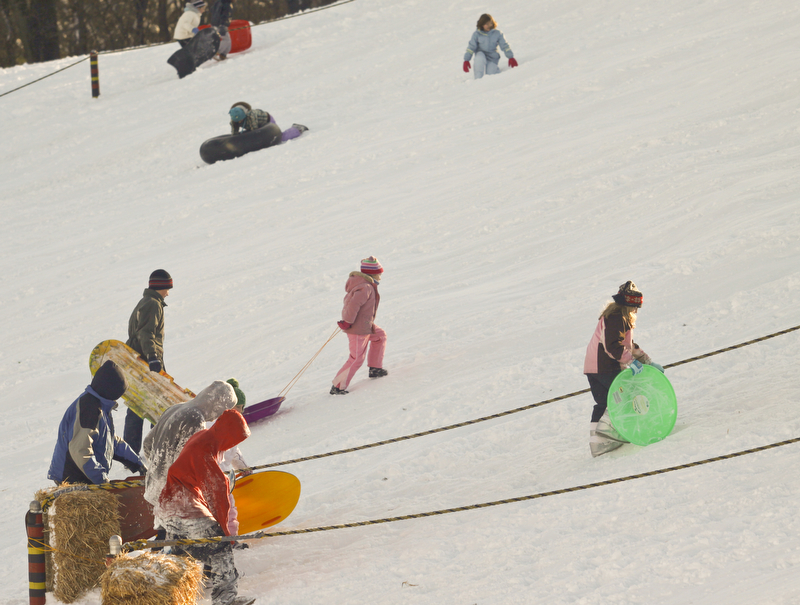 The Vindicator/Lisa-Ann Ishihara--- Residents have fun in the snow at Mill Creek Park's  Wick Recreation Area .