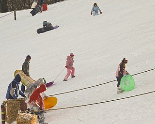 The Vindicator/Lisa-Ann Ishihara--- Residents have fun in the snow at Mill Creek Park's Wick Recreation Area .