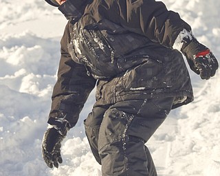 The Vindicator/Lisa-Ann Ishihara--- Dylan Ward (8) boards down the hill in the snow at Mill Creek Park's Wick Recreation Area .