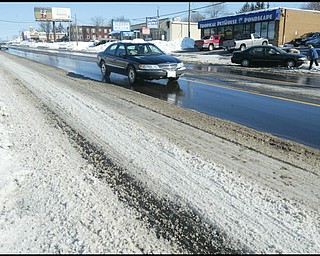 William D. Lewis /The vindicator  Market St in Boardman near Indianola Rd Monday morning. Snow  on street.