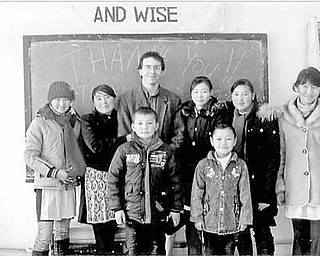 Special to The Vindicator
FOCUS ON CHILDREN: The latest undertaking for Warren Lions Club is the Kyrgyzstan Project, an effort to help students with vision problems in a remote village in Kyrgyzstan. The project was initiated when Atty. Elliott Legow mentioned to Dr. Richard Shapiro, retired ophthalmologist, that his son Ben Legow, a Peace Corps volunteer and teacher, was concerned about his students’ vision problems. At the suggestion of Dr. Shapiro, the Lions accepted the challenge of providing a solution. As a result, three frame companies agreed to donate 150 frames, Central Optical of Youngstown offered to fill the prescriptions, and RD Optical Company is coordinating the process. The glasses and fitting instructions will be sent to Ben Legow to give to the students. Any expenses involved in the project will be underwritten by the Lions. Awaiting the arrival of the glasses with Ben Legow are some of his students who will benefit from the endeavor.