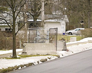 CAGED: An above-ground gas line was placed just off Cardinal Drive, by Canfield High School, several months ago while Columbia Gas of Ohio crews work on finishing underground lines that will supply more gas to an industrial business. The above-ground line is temporary and will be removed in the spring.