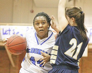 McDonald's Johvonnie Mosley (44) gets blocked by Lowellville's Kelly Hynes (21), Monday February 8, 2010