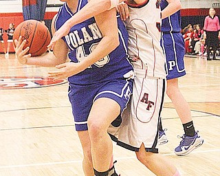 Adriana Sikora (40) of Poland and Stephanie Berdis (35) fight for the ball during their game Monday night in Austintown.