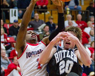 The Vindicator/Geoffrey Hauschild.YSU's DeAndre Mays (1) and Butler's Gordon Hayward (20) are unable to come up with a rebound during the second half of a game at YSU's Beeghley Center on Thursday evening.
