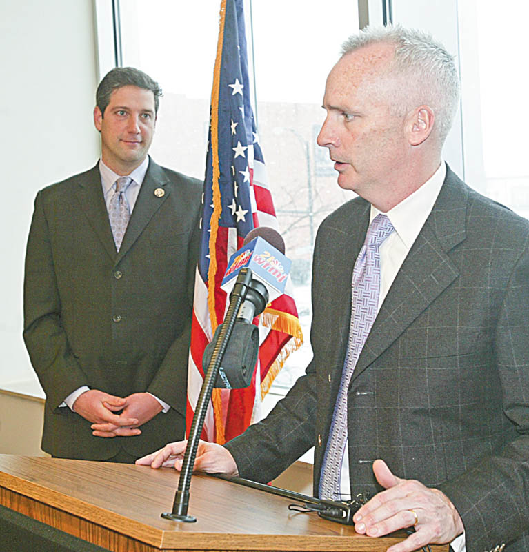 NEW COMPANY: Kevin O’Brien, chief executive officer of Revere Data, announces his company is relocating a research center’s operations from India to downtown Youngstown. Congressman Tim Ryan is at the left.