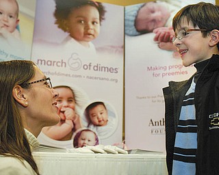 ALL SMILES: March of Dimes 2010 national ambassador, Joshua Hoffman of Weston, Fla., got some pointers from his mother, Melanie, on the speech he was about to deliver Tuesday to the MOD Mahoning Valley March for Babies Leadership Luncheon.