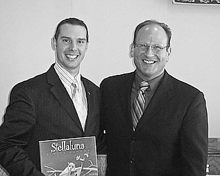 Special to The Vindicator
IN PRODUCTION: During a recent meeting of the Rotary Club of Austintown, Jack Ciarnello, at right, spoke of the growth of his business, Take Note Productions, in the Youngstown area. He told how he gave piano lessons and provided accompaniment for local musicians, created audition tapes for Youngstown State University students, and helped local musicians break into the recording business. He is now expanding into video production, proofreading and advertising. Following the talk, Brian Laraway, club president, at left, presented a book to the speaker. 
