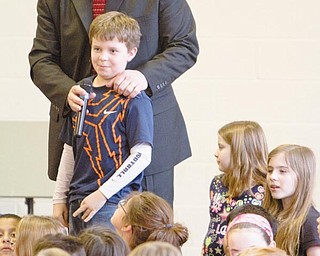 INQUIRY: C.H. Campbell Principal Kent Polen allows student Jack Villano to ask Jack Young, of Rotary International’s Shelter Box board of directors, a question during a Wednesday assembly at the Canfield school.