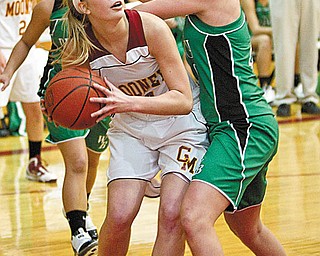 TOURNAMENT PREVIEW: Mooney’s Taylor Woytek (34) eyes the basket after making a rebound while defended by West Branch’s Andrea Wingett (40) during Wednesday’s game at Mooney. The Cardinals won, 33-31, and will play the Warriors again on Feb. 24 in the tournament.