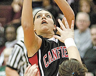 The Vindicator/Geoffrey Hauschild.Canfield's Jillian Halfhill (4) shoots past Boardman's Missy Demarinis (20).during the third quarter of a game at Boardman High School on Thursday evening.