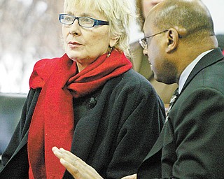 William D. Lewis/The Vindicator Kathy Witzman in Brookfield Court 2-18-10 on charges stemming a large number of animals kept on her Gustavas property. At right is her lawyer Charles Mickens.