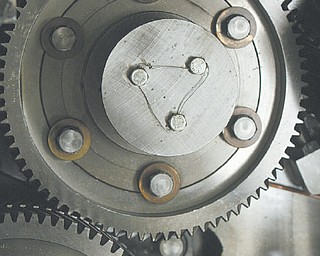 A detailed view of one of the many huge gears that moves the press.
