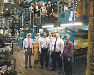 The Vindicator’s modern offset printing press will produce a brighter, bolder, more colorful newspaper in a new contemporary size. Standing in front of The Vindicator Printing Company’s
$10-million investment are, from left: Mark A. Brown, general manager; Betty H. Brown Jagnow, publisher; Ted Suffolk, assistant general manager; Ernie Brown Jr., regional editor/columnist; Rick
Wineman, pressroom foreman; Todd Franko, editor/columnist; and David Skolnick, politics writer/columnist. Above, Mike Hall, facilities manager; Bertram de Souza, editorial page writer/columnist; Jim Davies, production director; and Luis Salgado, lead press installer of Britton Services.