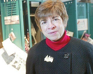 William D. Lewis/The Vindicator Dr. Donna DeBlasio, director of Youngstown State UniversityÕs Center for Applied History, in a reproduction of a workers locker room at the steel museum.