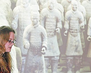 William D. LEwis/ The Vindicator Rochelle Beiersdorfer tallks about Terracotta Warriors during a Saturday event at YSU about China. Her father YSU Prof Ray Beiersdorfer recently led a group of YSU students on a trip to China.