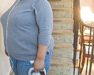 The Vindicator/Lisa-Ann Ishihara--- 212 Upland Ave in Youngstown is the residence of Rachel Wilkins. Oxygen tanks must use a portable oxygen tank because Rachel has sarcoidosis (***might not be this disease, double check with Pete's story****) Wells Fargo Bank filed a foreclosure action last month against this house in Mahoning County Common Pleas Court.
