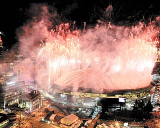 Fireworks explode over the BC Place after the closing ceremony of the Vancouver Winter Olympics in Vancouver, British Columbia, Sunday, Feb. 28, 2010.